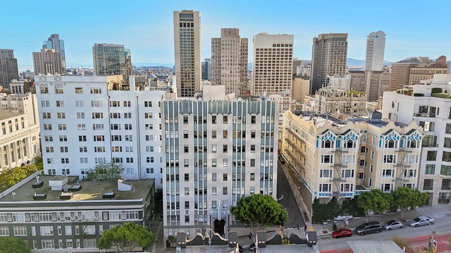 A cityscape with a mix of modern and older buildings.